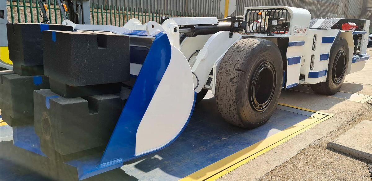 Underground hard rock mining vehicle being weighed before export